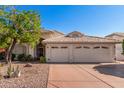 Single-story home with three-car garage and mature trees at 20047 N 109Th Dr, Sun City, AZ 85373