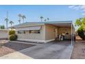 Front view of a manufactured home with a carport at 2650 W Union Hills Dr # 155, Phoenix, AZ 85027