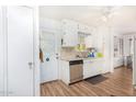 White kitchen with stainless steel dishwasher and view to exterior at 2650 W Union Hills Dr # 155, Phoenix, AZ 85027