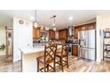 Spacious kitchen with granite countertops, stainless steel appliances, and an island at 1011 W Northern Ave, Phoenix, AZ 85021