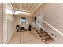 Home exterior with covered patio, steps, and small sitting area at 17200 W Bell Rd # 1218, Surprise, AZ 85374