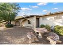 Relaxing patio area with mosaic table and benches, perfect for outdoor dining at 2716 E Voltaire Ave, Phoenix, AZ 85032