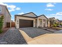 Modern home with two-car garage and driveway at 5117 E Paddock Pl, Scottsdale, AZ 85254