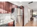 Updated kitchen with stainless steel refrigerator and wood cabinets at 9450 E Becker Ln # 1094, Scottsdale, AZ 85260