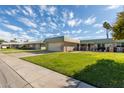 View of the front of the house and neighborhood at 9913 W Pleasant Valley Rd, Sun City, AZ 85351
