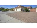 Two-car garage with paver driveway and gated entry at 26702 N 97Th Ln, Peoria, AZ 85383