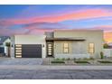 Modern house exterior with neutral color scheme and landscaped yard at 3125 N 86Th Pl, Scottsdale, AZ 85251