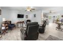 Open living space with a view into the kitchen area at 10213 W Kingswood Cir, Sun City, AZ 85351