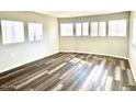 Bright living room with new vinyl plank flooring and lots of natural light at 710 S 97Th Way, Mesa, AZ 85208