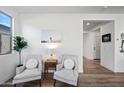 Cozy sitting area with two armchairs and a side table at 8222 E Jan Ave, Mesa, AZ 85209