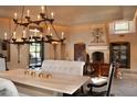 Elegant dining room featuring a large table, chandelier, and comfortable seating at 10040 E Happy Valley Rd # 504, Scottsdale, AZ 85255