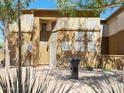 Townhome entrance with grill and landscaping at 1445 E Broadway Rd # 120, Tempe, AZ 85282