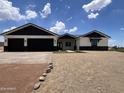 Modern home with a two-car garage and neutral color palette at 4237 E 4Th Ave, Apache Junction, AZ 85119