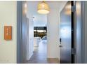 Bright entryway with modern door and view into the living area at 7120 E Kierland Blvd # 416, Scottsdale, AZ 85254