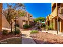 Apartment building with walkway and landscaping at 11640 N 51St Ave # 250, Glendale, AZ 85304