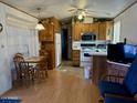 Eat-in kitchen with wood cabinets and modern appliances at 7750 E Broadway Rd # 149, Mesa, AZ 85208