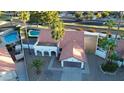 Single-story home with a charming terracotta roof, two-car garage, and a refreshing pool at 18645 N 71St Dr, Glendale, AZ 85308