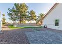 Landscaped backyard with a refreshing pool and patio area at 18645 N 71St Dr, Glendale, AZ 85308