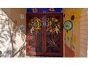 Welcoming entryway with decorative screen door and sunflower mural at 453 S Rosemont --, Mesa, AZ 85206