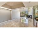 Spacious living room with marble floors and fireplace at 4710 N 65Th St, Scottsdale, AZ 85251