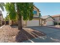 Two-story house with a white garage door and landscaping at 753 E Rosemonte Dr, Phoenix, AZ 85024