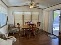 Light and airy dining area with wood table and chairs, and access to the outdoors at 7750 E Broadway Rd # 348, Mesa, AZ 85208