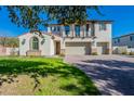 Stunning two-story home with well-manicured lawn and driveway at 12973 N Founders Park Blvd, Surprise, AZ 85379