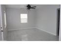 Spacious bedroom with tile flooring and a ceiling fan at 1637 W Garfield St, Phoenix, AZ 85007