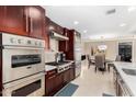Modern kitchen with stainless steel appliances and dark wood cabinetry at 7137 E Rancho Vista Dr # 2002, Scottsdale, AZ 85251