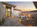 Charming front courtyard with seating area and desert landscaping at 14174 E Highland Ave, Fountain Hills, AZ 85268
