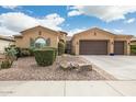 Beautiful house exterior with a two-car garage and well-manicured landscaping at 3291 E Cherrywood Pl, Chandler, AZ 85249