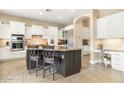 Spacious kitchen with granite countertops, stainless steel appliances, and an island at 3291 E Cherrywood Pl, Chandler, AZ 85249