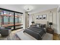 Main bedroom with hardwood floors and large windows providing natural light at 4808 N 24Th St # 531, Phoenix, AZ 85016