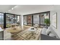 Bright living room with hardwood floors, large windows, and city views at 4808 N 24Th St # 531, Phoenix, AZ 85016