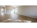 Bright dining room with vaulted ceiling and laminate flooring at 7832 W San Miguel Ave, Glendale, AZ 85303