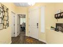 Bright entryway with wood-look flooring and coat rack at 1023 W Ingram St, Mesa, AZ 85201