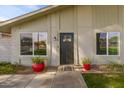 Contemporary front door entrance with red planters at 1026 N 85Th Pl, Scottsdale, AZ 85257