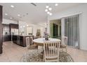 Eat-in kitchen with island and dark brown cabinetry at 11122 E Tripoli Ave, Mesa, AZ 85212