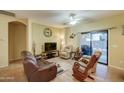 Living room with leather furniture and sliding glass doors at 2101 S Meridian Rd # 131, Apache Junction, AZ 85120