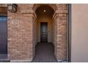 Brick entryway with arched doorway leading into the home at 375 E Bracciano Ave, Queen Creek, AZ 85140