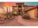 Two-story home with desert landscaping and sunset view at 2724 S Falling Star Rd, Gold Canyon, AZ 85118