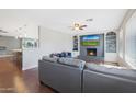 Cozy living room with a fireplace and hardwood floors at 4832 W Caron St, Glendale, AZ 85302