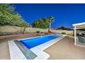 Inviting rectangular pool with a spa and a covered patio area at 3061 N Platina Cir # N, Mesa, AZ 85215