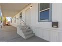 Front entrance of manufactured home with steps and railing at 5201 W Camelback Rd # A187, Phoenix, AZ 85031