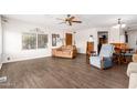 Spacious living room featuring hardwood floors and ample natural light at 8257 E Dutchman Dr, Mesa, AZ 85208