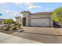 Single story home with a two-car garage and attractive landscaping at 21682 N 266Th Ave, Buckeye, AZ 85396