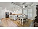 Eat-in kitchen with white cabinets, granite counters and island at 234 S 73Rd Way, Mesa, AZ 85208