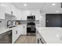 Sleek kitchen featuring white shaker cabinets and a quartz countertop at 2401 N 37Th St, Phoenix, AZ 85008