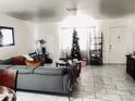 Living room with gray sectional sofa and Christmas tree at 4913 W Krall St, Glendale, AZ 85301