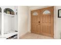 Entryway with wood-toned doors and built-in storage at 4937 N Granite Reef Rd, Scottsdale, AZ 85251